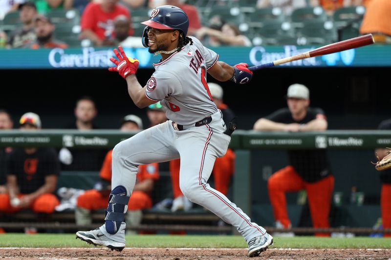 May 17, 2025; Baltimore, Maryland, USA; Washington Nationals third baseman Jose Tena (8) hits a single during the ninth inning against the Baltimore Orioles at Oriole Park at Camden Yards. Mandatory Credit: Daniel Kucin Jr.-Imagn Images