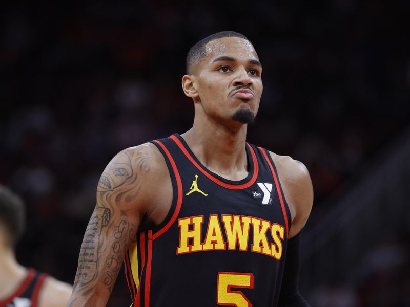 HOUSTON, TEXAS - DECEMBER 20: Dejounte Murray #5 of the Atlanta Hawks shoots a free throw against the Houston Rockets during the first half at Toyota Center on December 20, 2023 in Houston, Texas. User expressly acknowledges and agrees that, by downloading and or using this photograph, User is consenting to the terms and conditions of the Getty Images License Agreement.?  (Photo by Carmen Mandato/Getty Images)