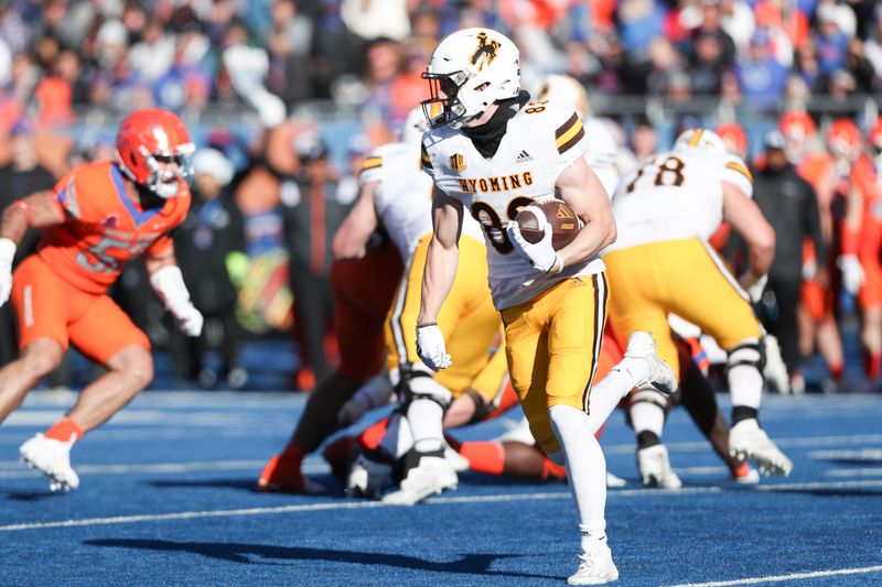 Oct 28, 2023; Boise, Idaho, USA; Wyoming Cowboys wide receiver Will Pelissier (83) runs for gain during the first half against the Boise State Broncos at Albertsons Stadium. Mandatory Credit: Brian Losness-USA TODAY Sports