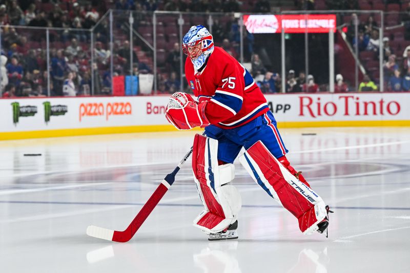 Jan 19, 2025; Montreal, Quebec, CAN; Montreal Canadiens goalie Jakub Dobes (75) skates on fresh ice towards his net during warm-up before the game against the New York Rangers at Bell Centre. Mandatory Credit: David Kirouac-Imagn Images
