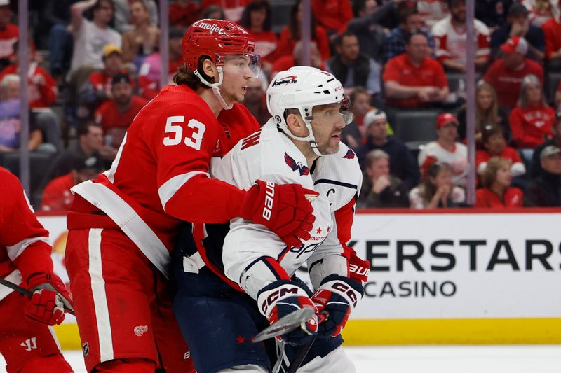 Apr 9, 2024; Detroit, Michigan, USA; Detroit Red Wings defenseman Moritz Seider (53) and Washington Capitals left wing Alex Ovechkin (8) fight for position in the third period at Little Caesars Arena. Mandatory Credit: Rick Osentoski-USA TODAY Sports