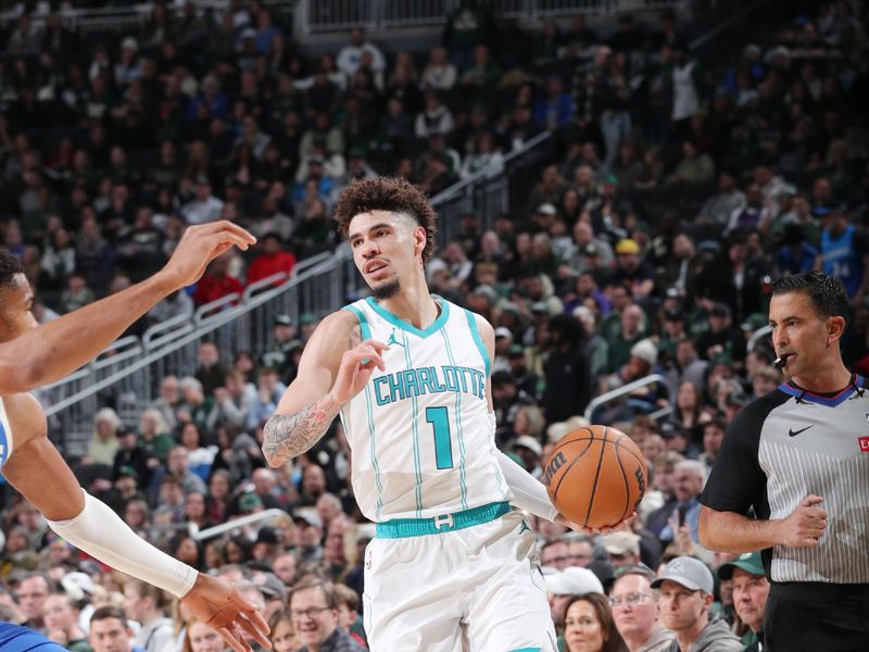 MILWAUKEE, WI - NOVEMBER 23: LaMelo Ball #1 of the Charlotte Hornets looks to pass the ball during the game against the Milwaukee Bucks on November 23, 2024 at the Fiserv Forum Center in Milwaukee, Wisconsin. NOTE TO USER: User expressly acknowledges and agrees that, by downloading and or using this Photograph, user is consenting to the terms and conditions of the Getty Images License Agreement. Mandatory Copyright Notice: Copyright 2024 NBAE (Photo by Gary Dineen/NBAE via Getty Images).