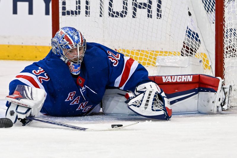 Feb 5, 2024; New York, New York, USA;  New York Rangers goaltender Jonathan Quick (32) makes a diving save against the Colorado Avalanche during the second period at Madison Square Garden. Mandatory Credit: Dennis Schneidler-USA TODAY Sports