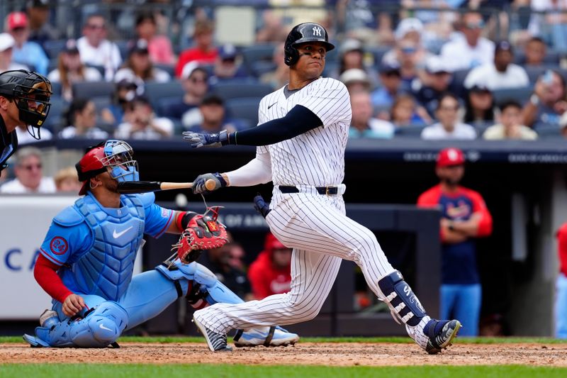 Aug 31, 2024; Bronx, New York, USA; New York Yankees right fielder Juan Soto (22) hits a double against the St. Louis Cardinals during the ninth inning at Yankee Stadium. Mandatory Credit: Gregory Fisher-USA TODAY Sports