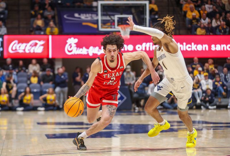 Mar 2, 2024; Morgantown, West Virginia, USA; Texas Tech Red Raiders guard Pop Isaacs (2) drives against West Virginia Mountaineers guard Noah Farrakhan (1) during the first half at WVU Coliseum. Mandatory Credit: Ben Queen-USA TODAY Sports