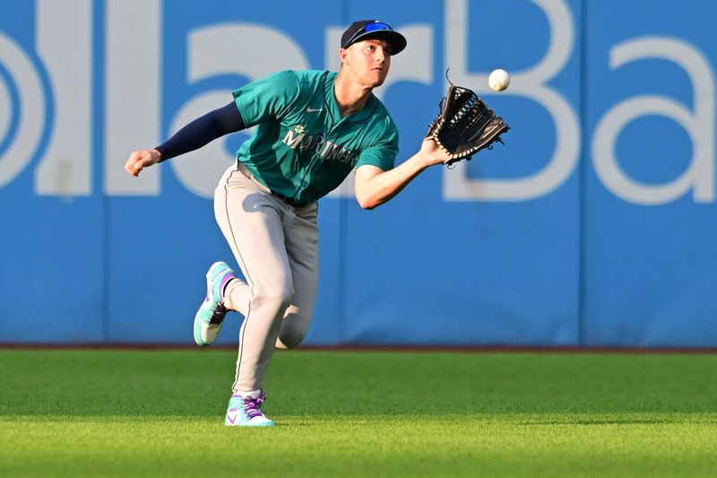 Jun 19, 2024; Cleveland, Ohio, USA; Seattle Mariners right fielder Dominic Canzone (8) catches a ball hit by Cleveland Guardians designated hitter David Fry (not pictured) during the third inning at Progressive Field. Mandatory Credit: Ken Blaze-USA TODAY Sports