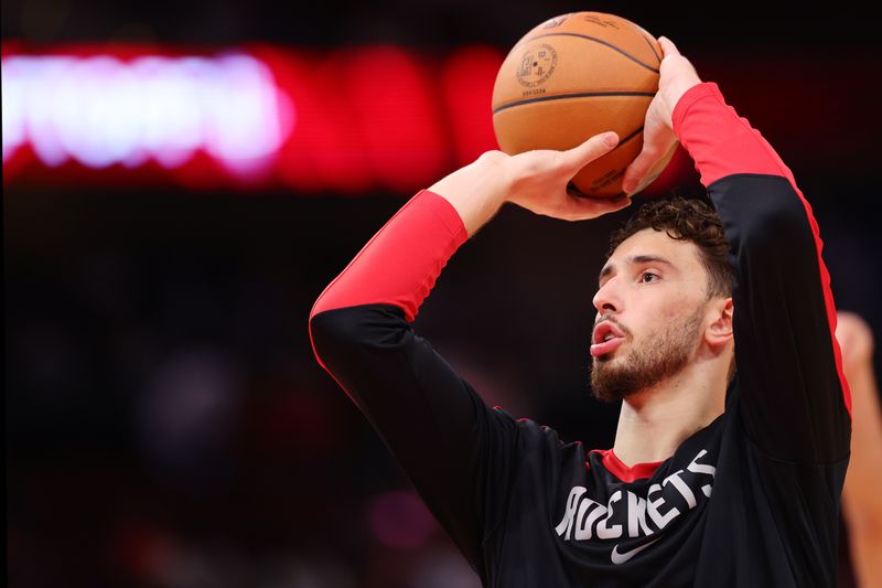 HOUSTON, TEXAS - OCTOBER 23: Alperen Sengun #28 of the Houston Rockets warms up prior to a game against the Charlotte Hornets at Toyota Center on October 23, 2024 in Houston, Texas.  NOTE TO USER: User expressly acknowledges and agrees that, by downloading and or using this photograph, User is consenting to the terms and conditions of the Getty Images License Agreement. (Photo by Alex Slitz/Getty Images)