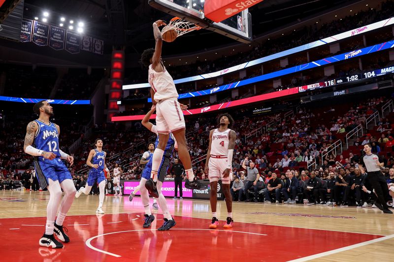 HOUSTON, TEXAS - APRIL 09: Amen Thompson #1 of the Houston Rockets dunks the ball in the fourth quarter against the Orlando Magic at Toyota Center on April 09, 2024 in Houston, Texas.  NOTE TO USER: User expressly acknowledges and agrees that, by downloading and or using this photograph, User is consenting to the terms and conditions of the Getty Images License Agreement. (Photo by Tim Warner/Getty Images)