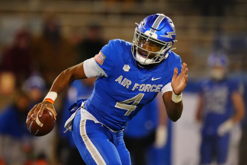 Nov 19, 2022; Colorado Springs, Colorado, USA; Air Force Falcons quarterback Haaziq Daniels (4) scrambles with the ball in the second half against the Colorado State Rams at Falcon Stadium. Mandatory Credit: Ron Chenoy-USA TODAY Sports