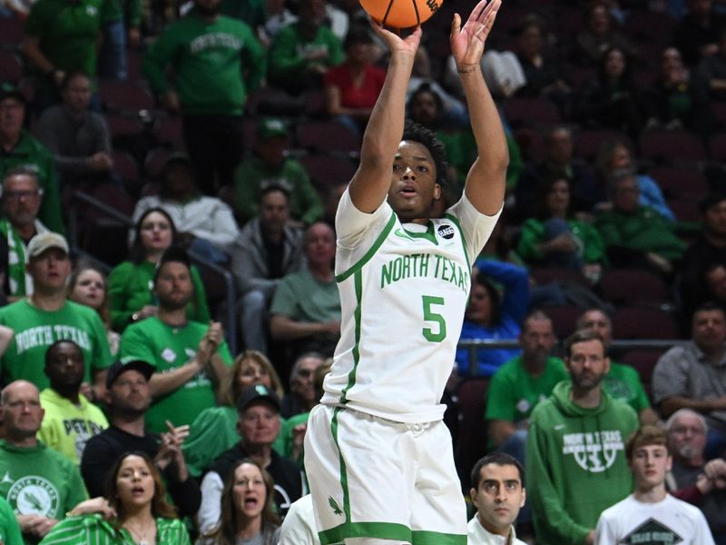 Mar 30, 2023; Las Vegas, NV, USA; North Texas Mean Green guard Tylor Perry (5) hits a shot in the second half against the UAB Blazers at Orleans Arena. Mandatory Credit: Candice Ward-USA TODAY Sports