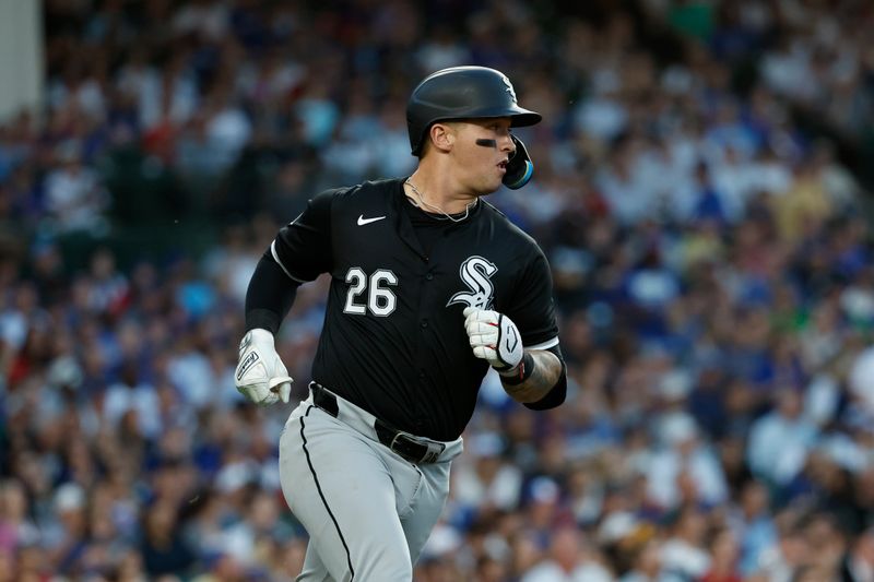 Jun 5, 2024; Chicago, Illinois, USA; Chicago White Sox catcher Korey Lee (26) runs to first base after hitting an RBI-single against the Chicago Cubs during the fourth inning at Wrigley Field. Mandatory Credit: Kamil Krzaczynski-USA TODAY Sports