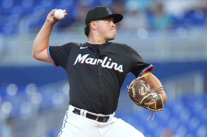 May 2, 2025; Miami, Florida, USA;  Miami Marlins pitcher Valente Bellozo (83) pitches against the Oakland Athletics in the second inning at loanDepot Park. Mandatory Credit: Jim Rassol-Imagn Images