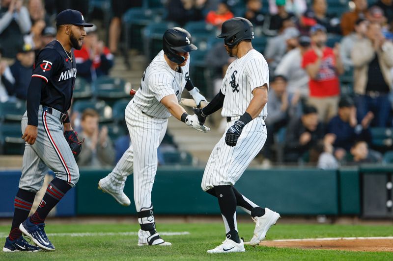 Apr 30, 2024; Chicago, Illinois, USA; Chicago White Sox outfielder Tommy Pham (28) is congratulated by outfielder Gavin Sheets (32) after scoring against the Minnesota Twins during the third inning at Guaranteed Rate Field. Mandatory Credit: Kamil Krzaczynski-USA TODAY Sports