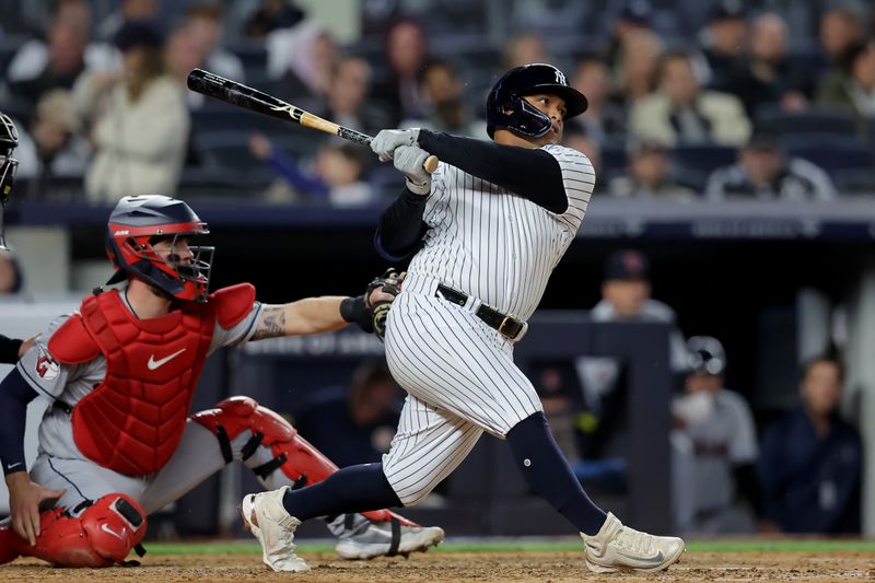 May 3, 2023; Bronx, New York, USA; New York Yankees designated hitter Willie Calhoun (24) follows through on a solo home run against the Cleveland Guardians during the fifth inning at Yankee Stadium. Mandatory Credit: Brad Penner-USA TODAY Sports