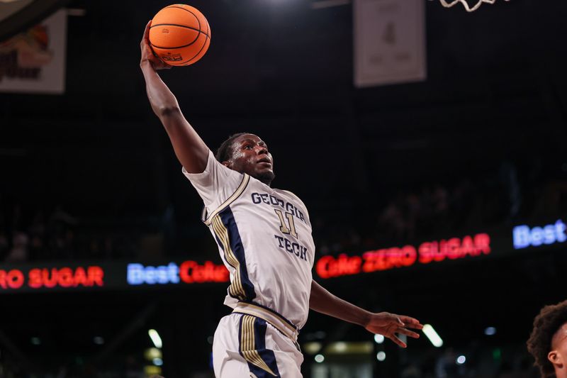 Jan 24, 2026; Atlanta, Georgia, USA; Georgia Tech Yellow Jackets forward Baye Ndongo (11) dunks against the Clemson Tigers in the second half at McCamish Pavilion. Mandatory Credit: Brett Davis-Imagn Images