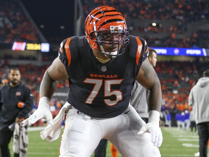 Cincinnati Bengals offensive tackle Orlando Brown Jr. (75) warms up before an NFL football game against the Buffalo Bills, Sunday, Nov. 5, 2023, in Cincinnati. (AP Photo/Gary McCullough)