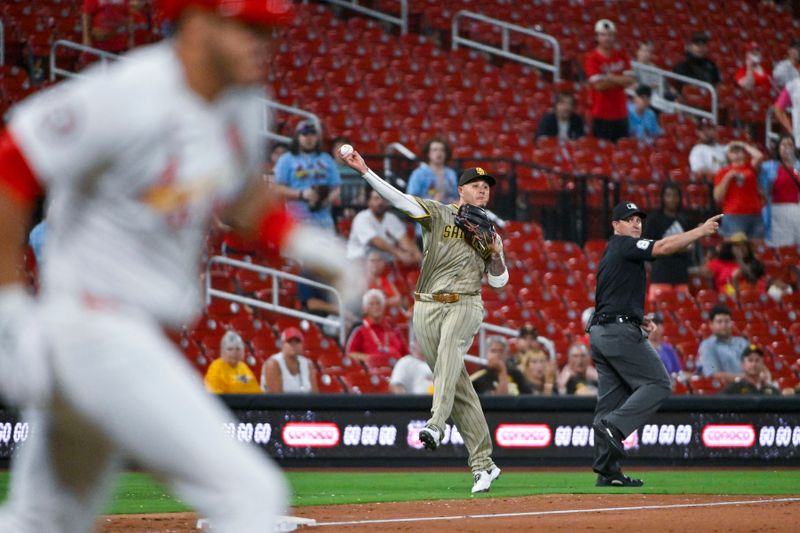 Aug 27, 2024; St. Louis, Missouri, USA;  San Diego Padres third baseman Manny Machado (13) throws out St. Louis Cardinals pinch hitter Nolan Arenado (not pictured) during the ninth inning at Busch Stadium. Mandatory Credit: Jeff Curry-USA TODAY Sports