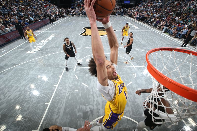 MEMPHIS, TN - MARCH 27: Jaxson Hayes #11 Of the Los Angeles Lakers dunks the ball during the game against the Memphis Grizzlies on March 27, 2024 at FedExForum in Memphis, Tennessee. NOTE TO USER: User expressly acknowledges and agrees that, by downloading and or using this photograph, User is consenting to the terms and conditions of the Getty Images License Agreement. Mandatory Copyright Notice: Copyright 2024 NBAE (Photo by Joe Murphy/NBAE via Getty Images)