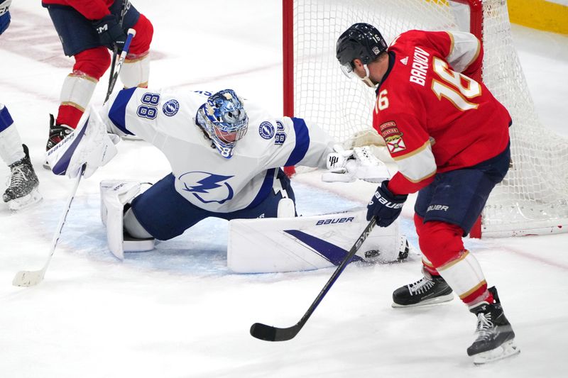 Apr 29, 2024; Sunrise, Florida, USA; Tampa Bay Lightning goaltender Andrei Vasilevskiy (88) makes a save against Florida Panthers center Aleksander Barkov (16) during the second period in game five of the first round of the 2024 Stanley Cup Playoffs at Amerant Bank Arena. Mandatory Credit: Jim Rassol-USA TODAY Sports