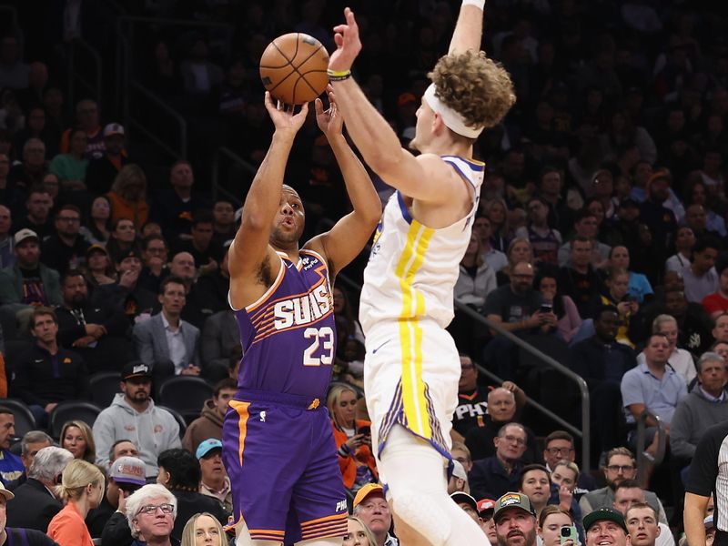 PHOENIX, ARIZONA - DECEMBER 12: Eric Gordon #23 of the Phoenix Suns attempts a three-point shot over Brandin Podziemski #2 of the Golden State Warriors during the first half of the NBA game at Footprint Center on December 12, 2023 in Phoenix, Arizona. NOTE TO USER: User expressly acknowledges and agrees that, by downloading and or using this photograph, User is consenting to the terms and conditions of the Getty Images License Agreement.  (Photo by Christian Petersen/Getty Images)