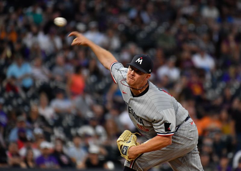 Sep 30, 2023; Denver, Colorado, USA; Minnesota Twins relief pitcher Emilio Pagan (15) delivers a pitch in the first inning against the Colorado Rockies at Coors Field. Mandatory Credit: John Leyba-USA TODAY Sports