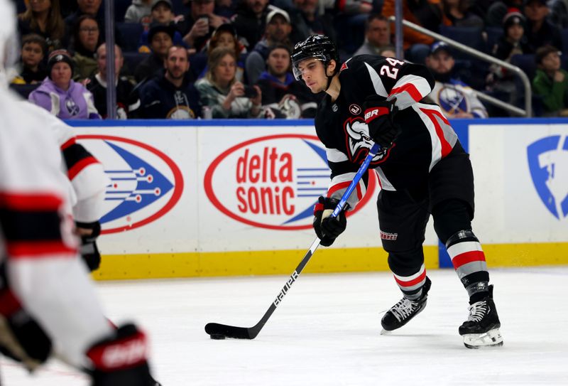 Jan 11, 2024; Buffalo, New York, USA;  Buffalo Sabres center Dylan Cozens (24) takes a shot on goal during the first period against the Ottawa Senators at KeyBank Center. Mandatory Credit: Timothy T. Ludwig-USA TODAY Sports