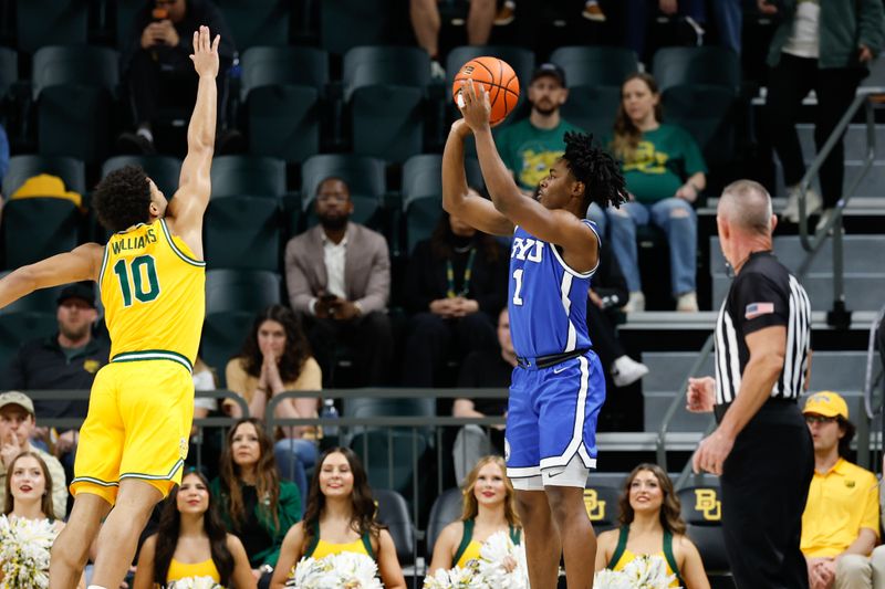 Feb 10, 2026; Waco, Texas, USA; BYU Cougars guard Robert Wright III (1) scores a three-point basket against Baylor Bears guard Isaac Williams (10) during the first half at Paul and Alejandra Foster Pavilion. Mandatory Credit: Chris Jones-Imagn Images