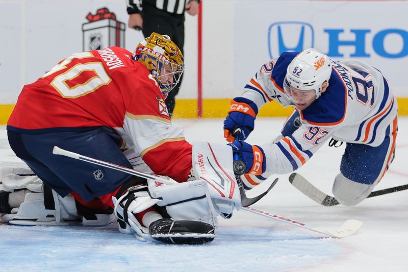 Nov 22, 2025; Sunrise, Florida, USA; Florida Panthers goaltender Daniil Tarasov (40) makes a save against Edmonton Oilers right wing Vasily Podkolzin (92) during the second period at Amerant Bank Arena. Mandatory Credit: Sam Navarro-Imagn Images