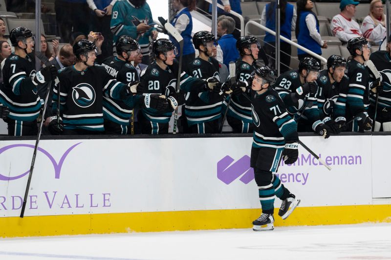 Nov 7, 2024; San Jose, California, USA;  San Jose Sharks center Macklin Celebrini (71) celebrates with the bench after scoring a goal during the third period against the Minnesota Wild at SAP Center at San Jose. Mandatory Credit: Stan Szeto-Imagn Images