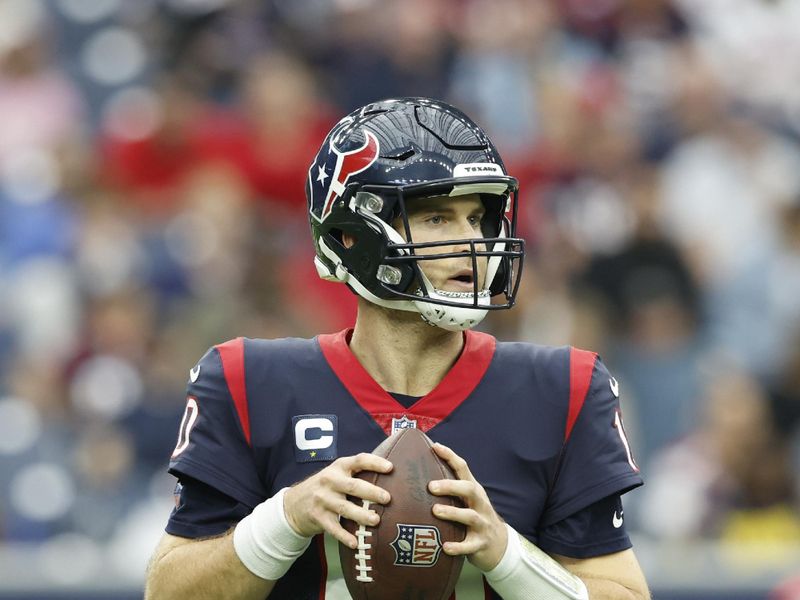 Houston Texans quarterback Davis Mills (10) looks to pass during an NFL football game against the Jacksonville Jaguars on Sunday, January 1, 2023, in Houston. (AP Photo/Matt Patterson)