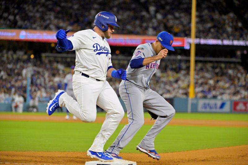Oct 20, 2024; Los Angeles, California, USA; Los Angeles Dodgers first baseman Max Muncy (13) is out at first base against New York Mets pitcher Edwin Diaz (39) in the fifth inning during game six of the NLCS for the 2024 MLB playoffs at Dodger Stadium. Mandatory Credit: Jayne Kamin-Oncea-Imagn Images