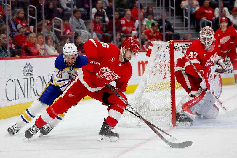 Mar 16, 2024; Detroit, Michigan, USA;  Detroit Red Wings defenseman Jake Walman (96) skates with the puck chased by Buffalo Sabres left wing Zemgus Girgensons (28) in the first period at Little Caesars Arena. Mandatory Credit: Rick Osentoski-USA TODAY Sports