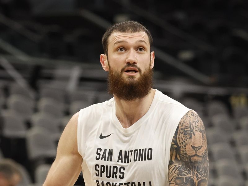 SAN ANTONIO, TX - JANUARY 27: Sandro Mamukelashvili #54 of the San Antonio Spurs takes warm up shots before their game against the Minnesota Timberwolves at Frost Bank Center on January 27, 2024 in San Antonio, Texas. NOTE TO USER: User expressly acknowledges and agrees that, by downloading and or using this photograph, User is consenting to terms and conditions of the Getty Images License Agreement. (Photo by Ronald Cortes/Getty Images)