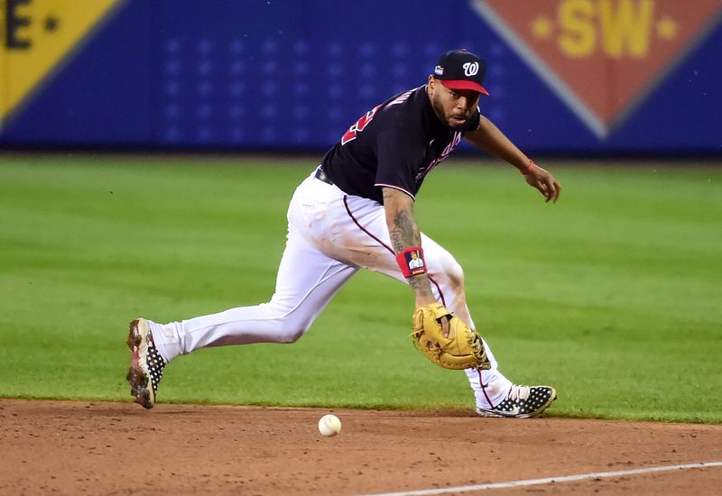 Aug 20, 2023; Williamsport, Pennsylvania, USA; Washington Nationals first baseman Dominic Smith (22) fields a ground ball in the sixth inning against the Philadelphia Phillies at Muncy Bank Ballpark at Historic Bowman Field. Mandatory Credit: Evan Habeeb-USA TODAY Sports