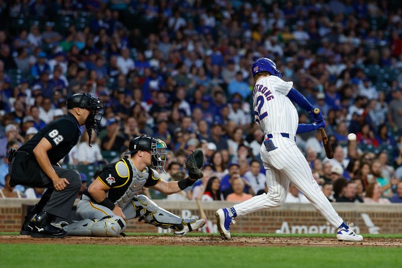 Sep 4, 2024; Chicago, Illinois, USA; Chicago Cubs outfielder Pete Crow-Armstrong (52) hits an RBI-double against the Pittsburgh Pirates during the second inning at Wrigley Field. Mandatory Credit: Kamil Krzaczynski-Imagn Images