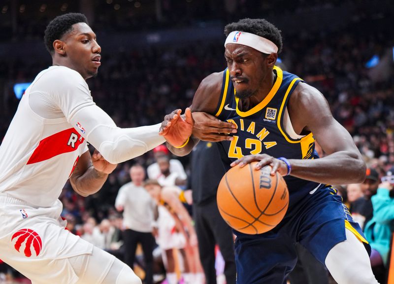 TORONTO, ON - NOVEMBER 18: Pascal Siakam #43 of the Indiana Pacers drives against RJ Barrett #9 of the Toronto Raptors during the first half at the Scotiabank Arena on November 18, 2024 in Toronto, Ontario, Canada. NOTE TO USER: User expressly acknowledges and agrees that, by downloading and/or using this Photograph, user is consenting to the terms and conditions of the Getty Images License Agreement. (Photo by Mark Blinch/Getty Images)