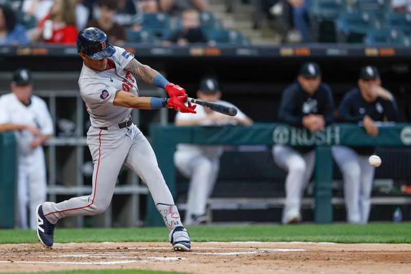 Jun 6, 2024; Chicago, Illinois, USA; Boston Red Sox outfielder Ceddanne Rafaela (43) hits a two-run single against the Chicago White Sox during the second inning at Guaranteed Rate Field. Mandatory Credit: Kamil Krzaczynski-USA TODAY Sports