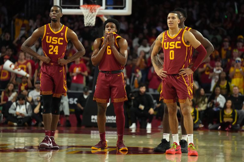 Jan 27, 2024; Los Angeles, California, USA; Southern California Trojans forward Joshua Morgan (24), guard Bronny James (6) and guard Kobe Johnson (0) react against the UCLA Bruins in the first half at Galen Center. Mandatory Credit: Kirby Lee-USA TODAY Sports