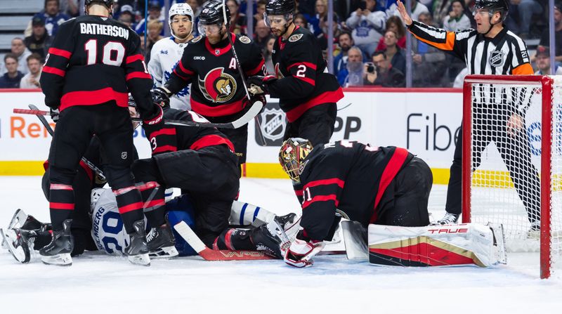 Jan 25, 2025; Ottawa, Ontario, CAN; Ottawa Senators goalie Anton Forsberg (31) makes a save against the Toronto Maple Leafs in the second period at the Canadian Tire Centre. Mandatory Credit: Marc DesRosiers-Imagn Images