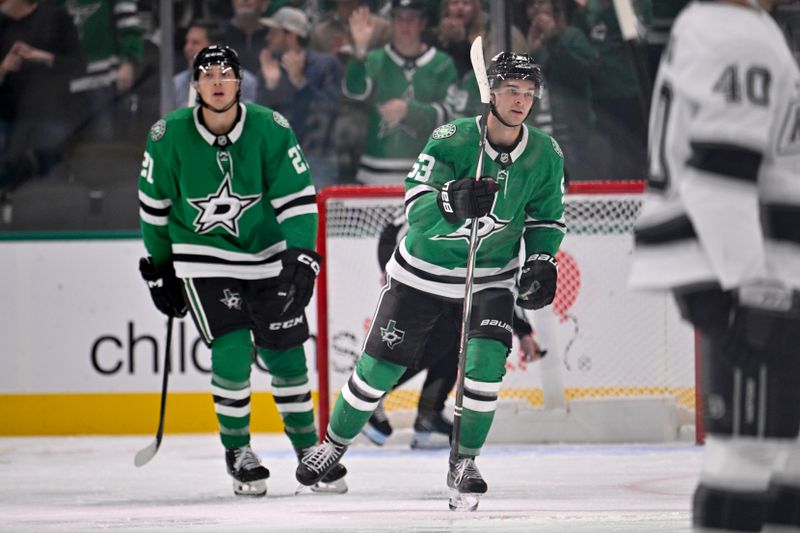 Oct 23, 2025; Dallas, Texas, USA; Dallas Stars center Wyatt Johnston (53) and left wing Jason Robertson (21) skate off the ice after Johnston scores a a power-play goal against the Los Angeles Kings during the third period at the American Airlines Center. Mandatory Credit: Jerome Miron-Imagn Images