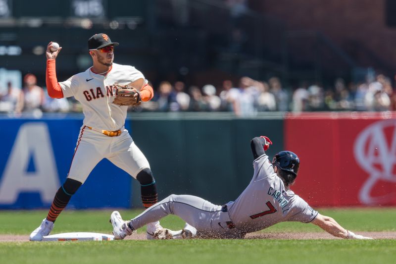 Apr 21, 2024; San Francisco, California, USA;  San Francisco Giants second baseman Thairo Estrada (39) tags Arizona Diamondbacks center fielder Corbin Carroll (7) in the first part of a double play during the first inning at Oracle Park. Mandatory Credit: John Hefti-USA TODAY Sports