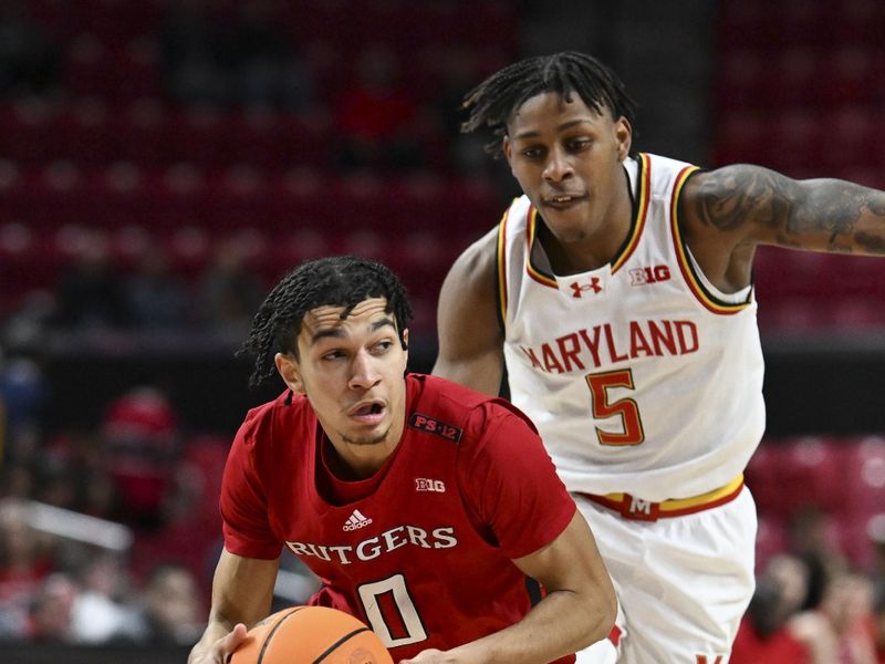 Feb 6, 2024; College Park, Maryland, USA; Rutgers Scarlet Knights guard Derek Simpson (0) cuts by Maryland Terrapins guard DeShawn Harris-Smith (5) during the first half  at Xfinity Center. Mandatory Credit: Tommy Gilligan-USA TODAY Sports