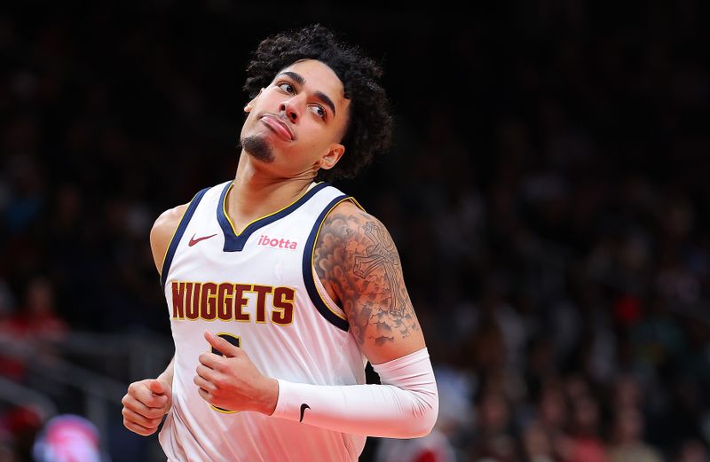 ATLANTA, GEORGIA - DECEMBER 11:  Julian Strawther #3 of the Denver Nuggets reacts after hitting a three-point basket against the Atlanta Hawks during the third quarter at State Farm Arena on December 11, 2023 in Atlanta, Georgia.  NOTE TO USER: User expressly acknowledges and agrees that, by downloading and/or using this photograph, user is consenting to the terms and conditions of the Getty Images License Agreement.  (Photo by Kevin C. Cox/Getty Images)