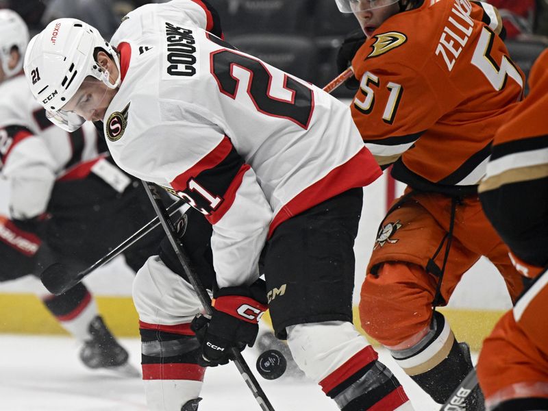 Dec 1, 2024; Anaheim, California, USA;  Ottawa Senators center Nick Cousins (21) takes a shot with pressure from Anaheim Ducks defenseman Olen Zellweger (51) during the first period at Honda Center. Mandatory Credit: Alex Gallardo-Imagn Images