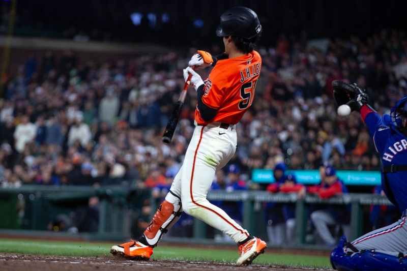 Apr 25, 2025; San Francisco, California, USA; San Francisco Giants center fielder Jung Hoo Lee (51) ducks out of the way of a high and tight pitch from Texas Rangers pitcher Robert Garcia (62) during the ninth inning at Oracle Park. Umpires ruled that Lee was hit by the 2-2 pitch, but that he also offered at it, and thus was out. Mandatory Credit: D. Ross Cameron-Imagn Images
