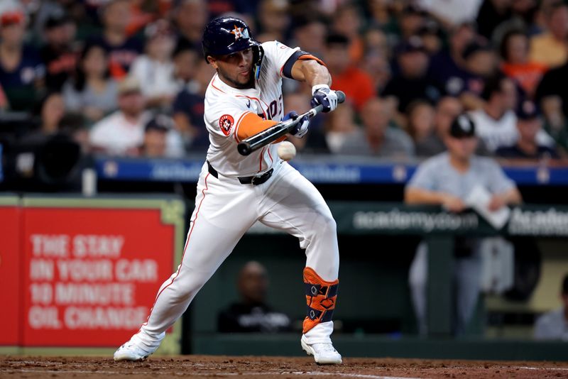 Aug 18, 2024; Houston, Texas, USA; Houston Astros right fielder Pedro Leon (4) bunts against the Chicago White Sox during the third inning at Minute Maid Park. Mandatory Credit: Erik Williams-USA TODAY Sports