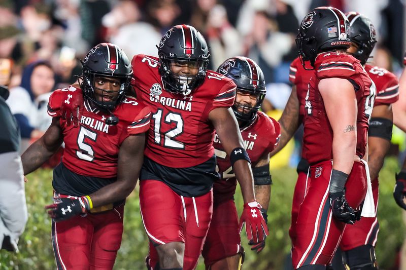 Nov 19, 2022; Columbia, South Carolina, USA; South Carolina Gamecocks wide receiver Dakereon Joyner (5) and tight end Traevon Kenion (12) celebrate after a touchdown against the Tennessee Volunteers in the second half at Williams-Brice Stadium. Mandatory Credit: Jeff Blake-USA TODAY Sports