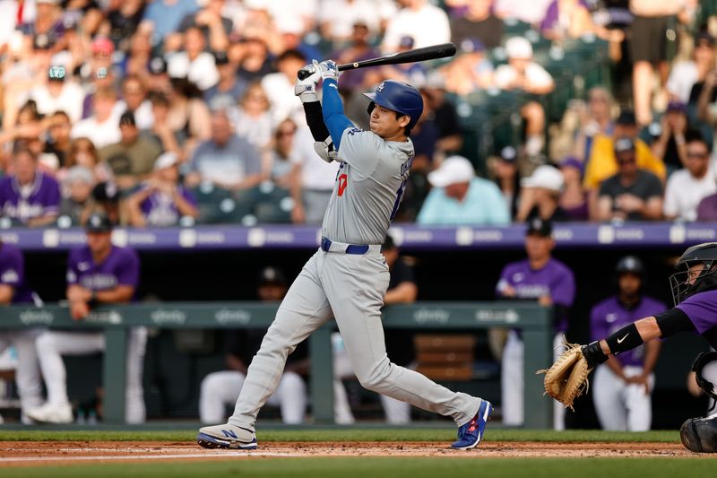 Jun 17, 2024; Denver, Colorado, USA; Los Angeles Dodgers designated hitter Shohei Ohtani (17) hits a single in the second inning against the Colorado Rockies at Coors Field. Mandatory Credit: Isaiah J. Downing-USA TODAY Sports