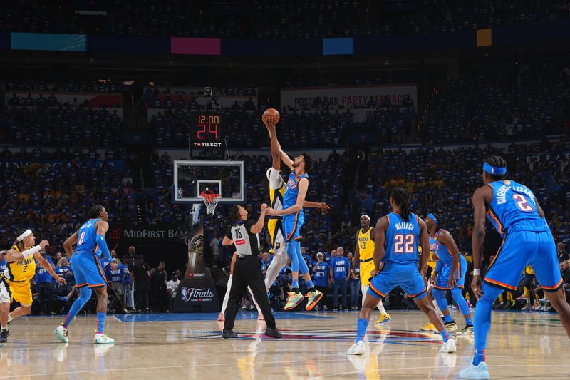 OKLAHOMA CITY, OK - JUNE 8: Myles Turner #33 of the Indiana Pacers and Chet Holmgren #7 of the Oklahoma City Thunder go up for the opening tip off during Game Two of the 2025 NBA Finals on June 8, 2025 at Paycom Center in Oklahoma City, Oklahoma. NOTE TO USER: User expressly acknowledges and agrees that, by downloading and or using this photograph, User is consenting to the terms and conditions of the Getty Images License Agreement. Mandatory Copyright Notice: Copyright 2025 NBAE (Photo by Jesse D. Garrabrant/NBAE via Getty Images)