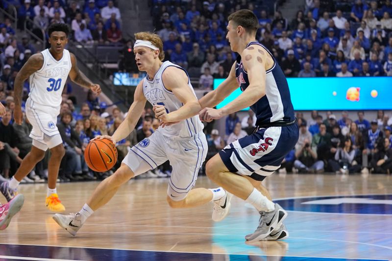 Jan 26, 2026; Provo, Utah, USA; BYU Cougars guard Richie Saunders (15) drives during the first half against the Arizona Wildcats at Marriott Center. Mandatory Credit: Aaron Baker-Imagn Images 